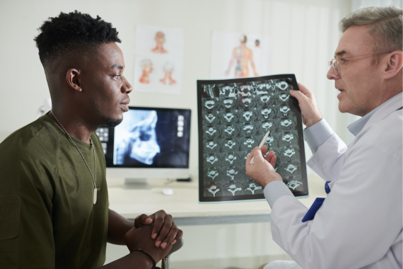 doctor-explaining-cause-of-back-pain-2022-08-18-15-30-03-utc