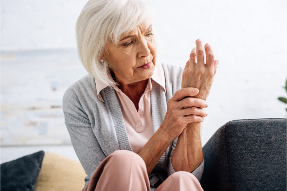 senior-woman-having-hand-arthritis-and-sitting-on-2021-08-30-01-25-54-utc