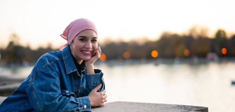 woman with cancer in front of lake