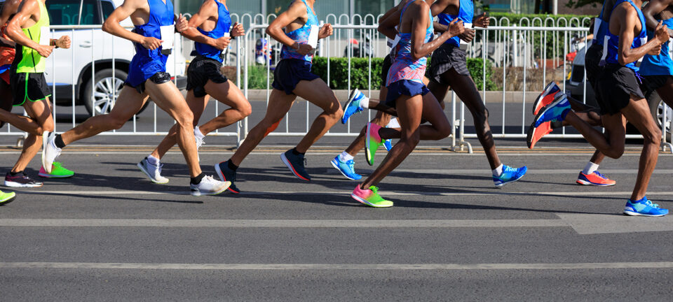 Marathon,Runners,Legs,Running,On,City,Road