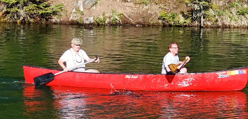 red canoe on lake
