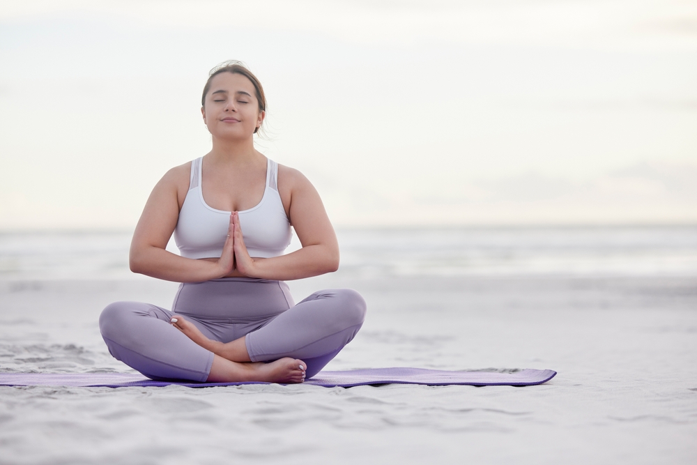 yoga on beach woman